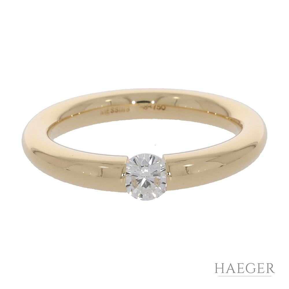 Zeitloser Diamant Spannring aus dem Hause Niessing in edlem 750er Gelbgold gefertigt