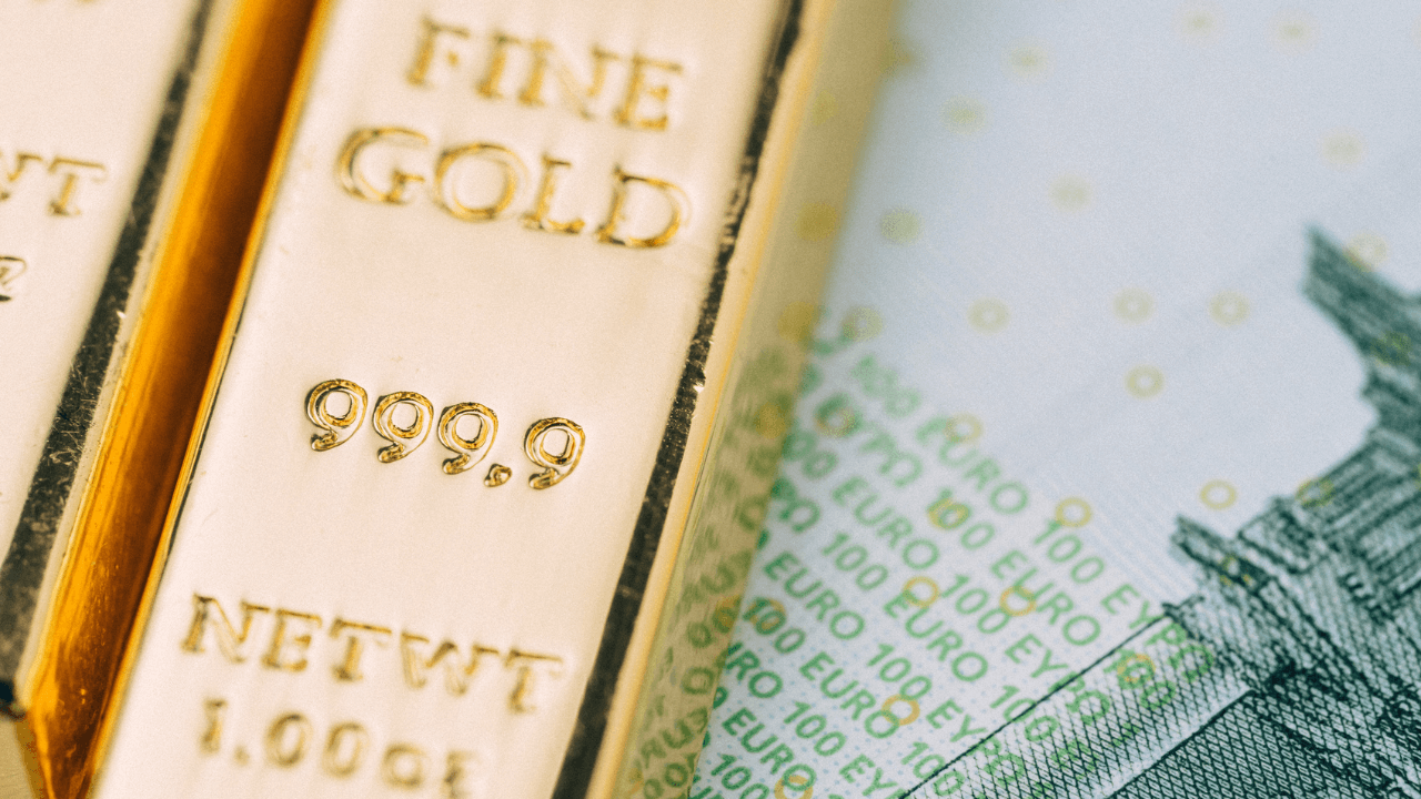 Feingoldbarren und Geldschein Euro